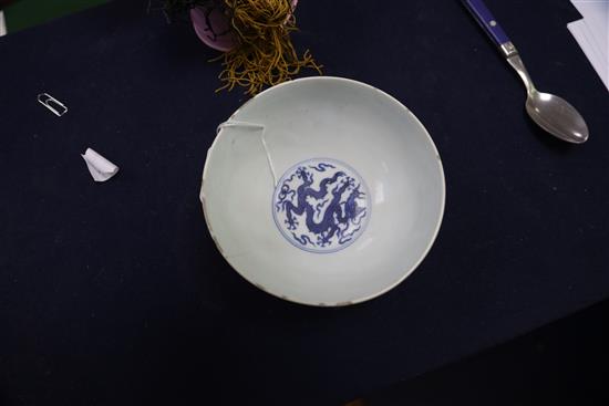 A Chinese blue and white dragon bowl, Qianlong seal mark and period (1736-95), D. 14.7cm, faults